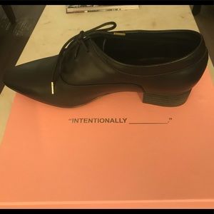 New Intentionally Blank black leather shoes.